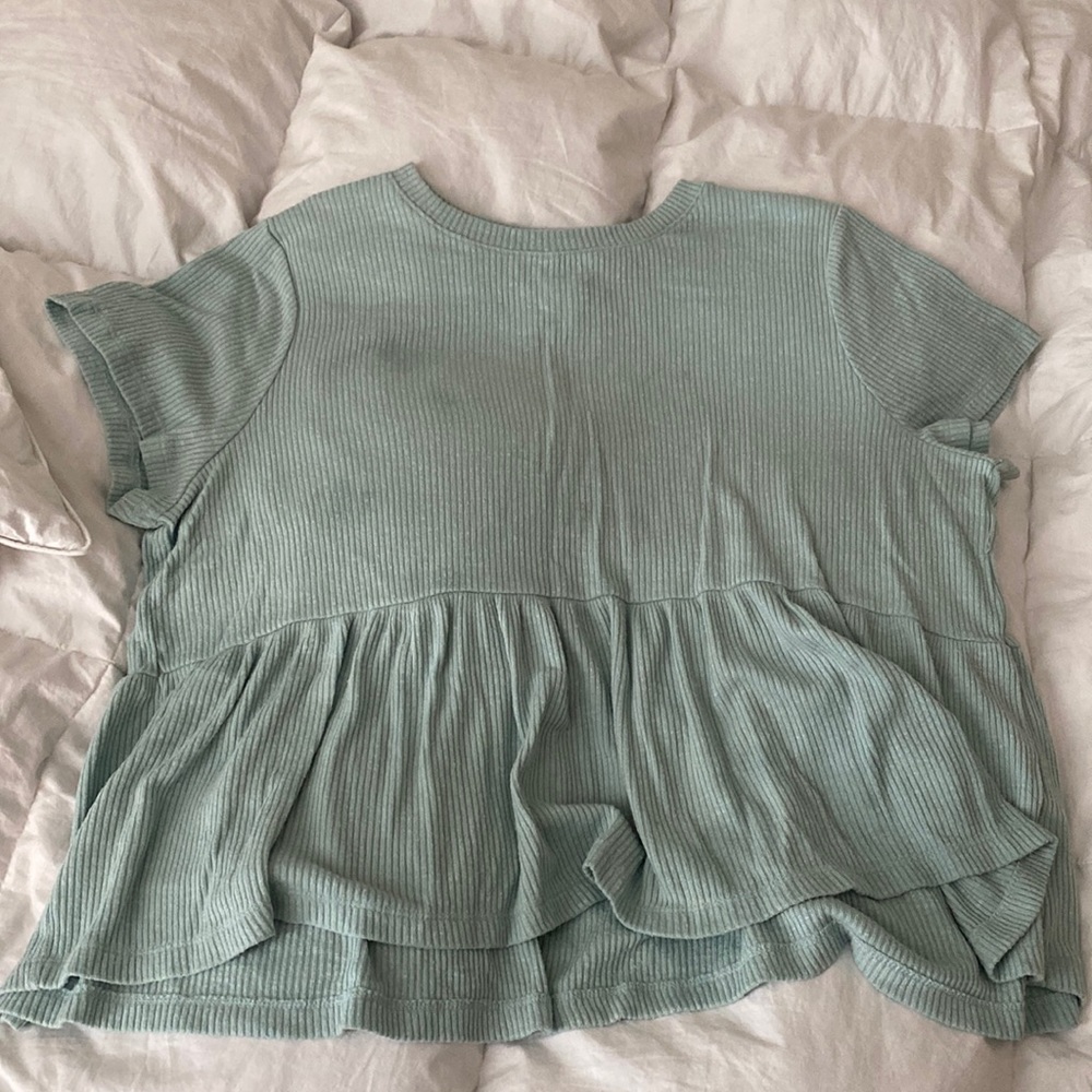 teal woman’s shirt